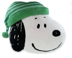 a stuffed dog with a green hat on it's head