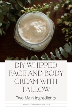 whipped face and body cream with tallow in a glass jar surrounded by greenery