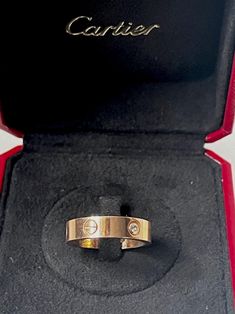 Lovely Cartier Love Ring in yellow gold and diamonds , decorated with of engraved screw patterns. Signature: Cartier and numbered (0.5 mm width).  Weight: 10.1 grams Ring US size: 9.5   Very good antique conditions. Thank you for visiting Boudoir Vintage!   Please feel free to contact me for further information or photos.  I offer international shipping. Your item will be packed with extreme care and will be shipped within 3-5 working days. If you are dissatisfied with your item, please feel free to contact me and would be happy to assist.  If you are interested in paying in installments or reserve an item, please send me an inquiry. To continue visiting my shop, please visit  https://www.etsy.com/shop/BoudoirVintageBijoux/ FOLLOW ME on Instagram: https://www.instagram.com/boudoir_vintage/ Cartier Love Ring Gold On Hand, Cartier And Tiffany Rings, Luxury Engraved Cartier Jewelry, Cartier Timeless Luxury Wedding And Engagement Rings, Luxury Timeless Cartier Wedding And Engagement Rings, Luxury Cartier Jewelry For Promise Ring, Luxury Cartier Fine Jewelry Rings, Cartier Love Ring With Engagement Ring Diamond, Luxury Cartier Jewelry For Anniversary