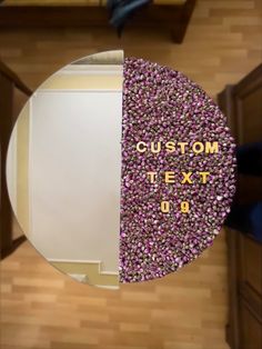 an overhead view of a table with the text custom next to it in gold and purple