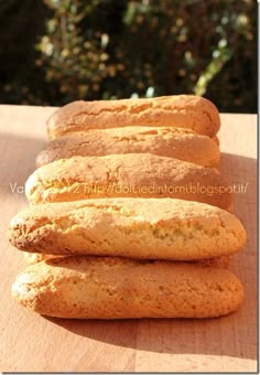 four cookies sitting on top of a wooden table