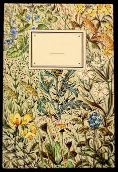 an old book with flowers and plants on it