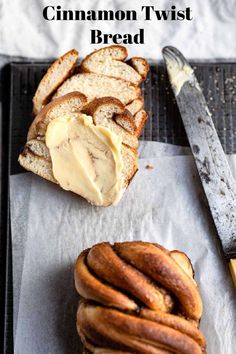 cinnamon twist bread on a baking sheet with butter spread in between it and a knife