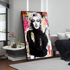 a living room with a large painting on the wall