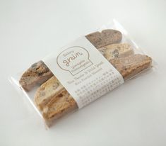 some cookies are wrapped in plastic on a white surface