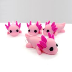 Cute pink baby axolotl charms or pendants for jewelry making. Cute Clay Axolotl, Small Polymer Clay Animals, Cute Little Clay Things Ideas, Small Animal Sculptures, Axolotl Clay Art, Axolotl 3d Print, Polymer Clay Cute Earrings, Clay Crafts Ideas Easy