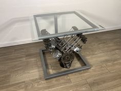 a glass table with an engine underneath it