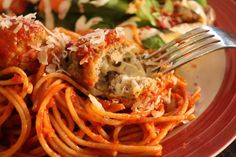 a plate with spaghetti and meatballs on it