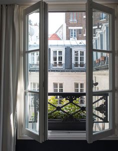 an open window looking out onto a balcony