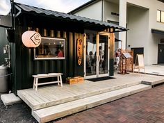 the outside of a restaurant with wooden steps leading up to it