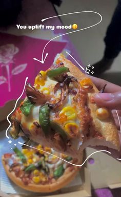 a person holding a slice of pizza with different toppings