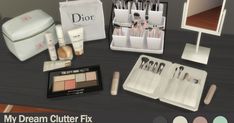 an assortment of makeup and beauty products displayed on a table with the words, my dream clutter fix