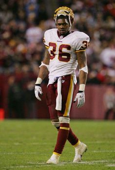 a football player standing on top of a field