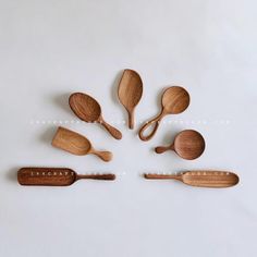 wooden spoons and spatulas arranged in the shape of a circle