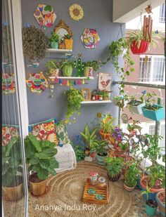 a room filled with lots of plants and potted plants