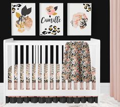 a baby's room with black walls, pink curtains and art on the wall