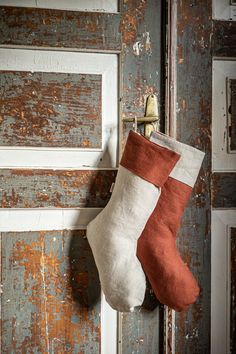 a christmas stocking hanging on an old door