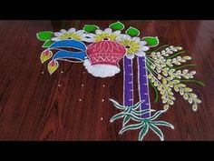 a wooden table topped with lots of different colored items on top of wood flooring