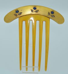 This is so incredible.... I am very very very... excited to offer this Victorian Hair Comb.. It is of French origin and crafted from 18K solid yellow gold. It is hallmarked and tested as 18K (French eagles head). This comb features three floral motifs (thistles). Each flower is accented with natural blue oval cut sapphires with the leaves decorated in rose cut diamonds. The comb is horn and in remarkably wonderful condition with no breaks or cracks in the horn, simply very minimal wear. We date Antique Hair Combs, Victorian Hair, Tiaras Jewellery, Victorian Hairstyles, Vintage Hair Combs, Hair Adornments, The Horn, Head Hair, Tiaras And Crowns