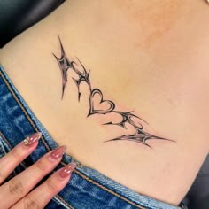 a woman's stomach with a tattoo design on it