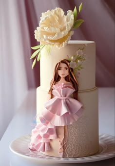 a cake decorated with a doll and flowers