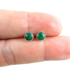 A darling pair of simple Malachite Stud Earrings in Sterling Silver.These earrings are made with a 5mm malachite stone and sterling silver.Your choice of either a plain bezel or serrated bezel.Your earrings will come with sterling silver butterfly backs.Mix and match with my other stud earrings*Please note as with all natural gemstones the color may vary from the pair shown.Great for sensitive ears!This listing is for one pair of earrings. Earrings are shipped in a gift box. Style Aesthetics, Malachite Earrings, Minimalist Earrings Studs, Minimalist Studs, Silver Jewelry Earrings, Malachite Stone, Earrings Dainty, Earrings Green, Stone Studs