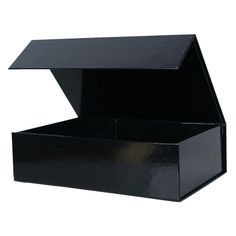 an open black box sitting on top of a white surface