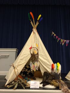 M final creation for our school auction. North American Indian TeePee with Dream Catcher made by the children - cushions, blanket and rug inside to create the perfect hideaway. Dress up set included with headdress, booties and fake fur cape. The children also decorated strings with feathers and beads to hang from top of poles. Indian Teepee, Tent Party, Kids Cafe, School Auction, Horses Theme, Tent Decorations, Teepee Kids, Fur Cape, Teepee Tent