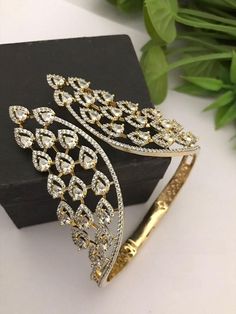 Material:  brass, CZ  Gold Plated Diamond bracelet detailed with the hearts of cz stones.  Suitable for all kind of outfits like Kurtis lehanga Sarees,  Denims and Trousers. Arrives in a small plastic box. Highest quality of Craftsmanship. Please let me know if you any questions. Lehanga Saree, Bracelet Indian, Sabyasachi Jewellery, Bracelet Diamond, Cz Bracelet, Indian Jewellery, Cz Stone, Arm Band, Diamond Bracelet