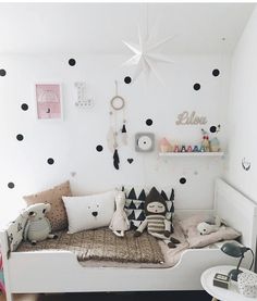 a bedroom with polka dots on the wall