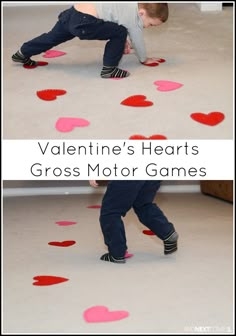 two children are playing with hearts on the floor and one child is standing in front of them