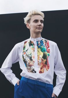 Photo from Bull and dagger website. This female model is presented in a more masculine way, representing a clothing company that promotes genderqueer fashion (2019) Queer High Fashion, Nonbinary Aesthetic Fashion, Pink Queer Fashion, Androgynous Pride Outfit, Queer Button Up, Dagger Collar Shirt, Purple Waistcoat, Non Binary Fashion, Tux Shirt