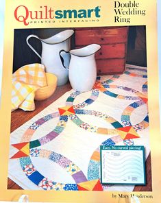 the cover of quiltsmart magazine features two pitchers and a table runner on it