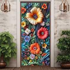 an open door with colorful flowers painted on the front and side panels, next to potted plants