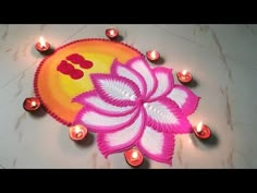 an image of a flower with candles on the ground for diwaling or decorating