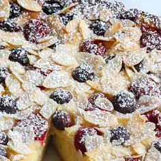 a pie with blueberries and almonds on it