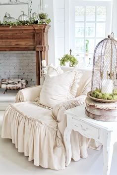 a living room filled with furniture and a birdcage