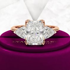 a diamond ring with three pear shaped diamonds on it