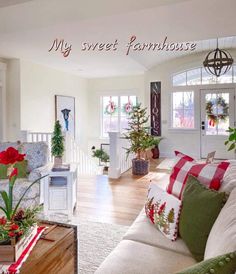 a living room filled with lots of furniture and christmas decorations on top of the couches