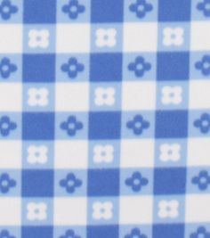 a blue and white checkered pattern with flowers on it