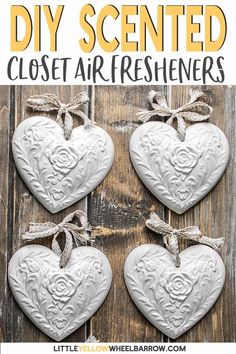 three white heart shaped ornaments hanging on a wooden wall with text overlay that says diy air freshener scented with essential oils