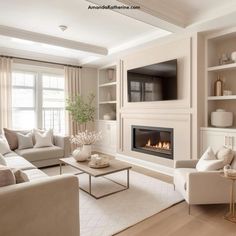 a living room filled with furniture and a fire place in the middle of the room