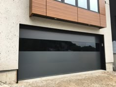 an image of a modern garage door in front of a house