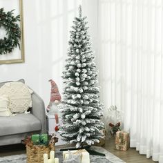 a living room with a christmas tree in the corner and presents on the floor next to it