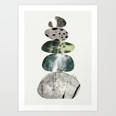 an art print with rocks stacked on top of each other in shades of green and grey