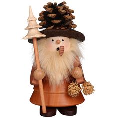 a wooden figurine holding a pine cone and wearing a brown hat with an acorn