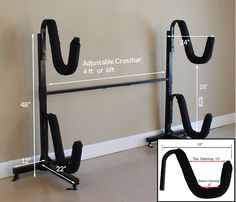 a pair of black bike racks are shown with measurements for each tire and the height