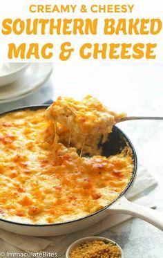 creamy and cheesy southern baked mac & cheese in a skillet with a serving spoon