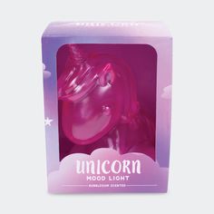 a pink unicorn toy in a purple box