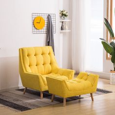 a yellow chair and ottoman in a white room with a clock on the wall behind it